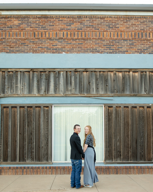 Couple standing in front of old building